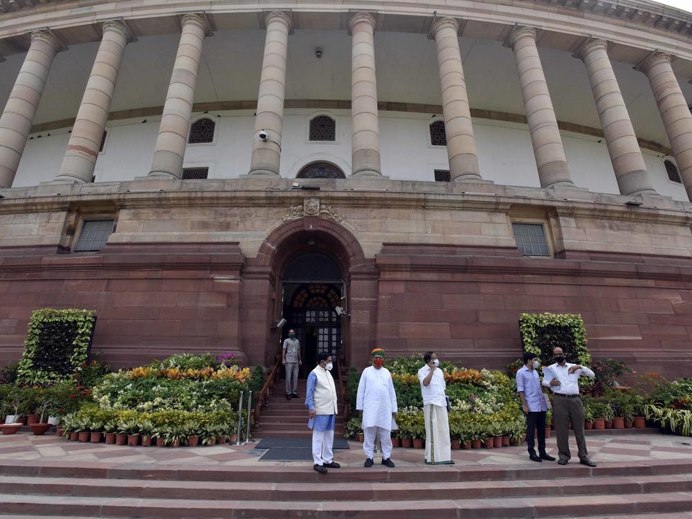 Politicians gathered at India's Parliament House ahead of the first session in six months, on Sept. 13 in New Delhi. Lawmakers were required to get tested for the coronavirus within 72 hours before entering parliament.