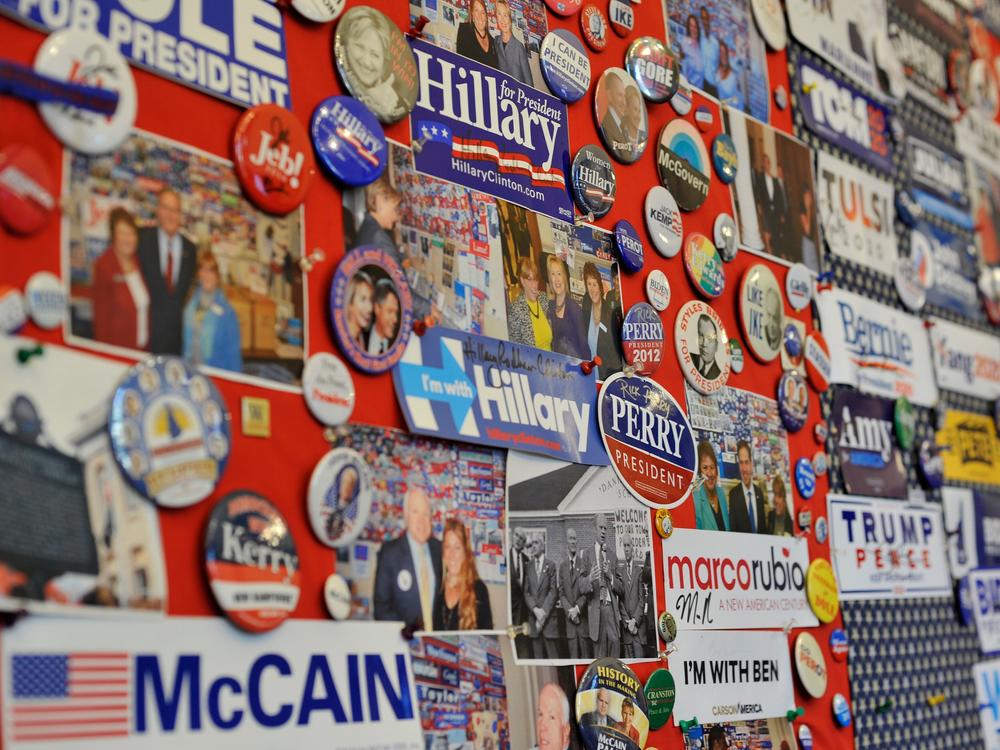 A collection of current and past presidential advertising materials hangs on a wall in the visitor center of the New Hampshire State House in Concord, N.H.