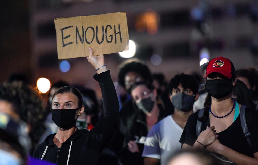 Demonstrators gather during a rally in Dr. Martin Luther King, Jr. Memorial Park in Rochester, N.Y., Friday, Sept. 4 to protest the death of Daniel Prude.