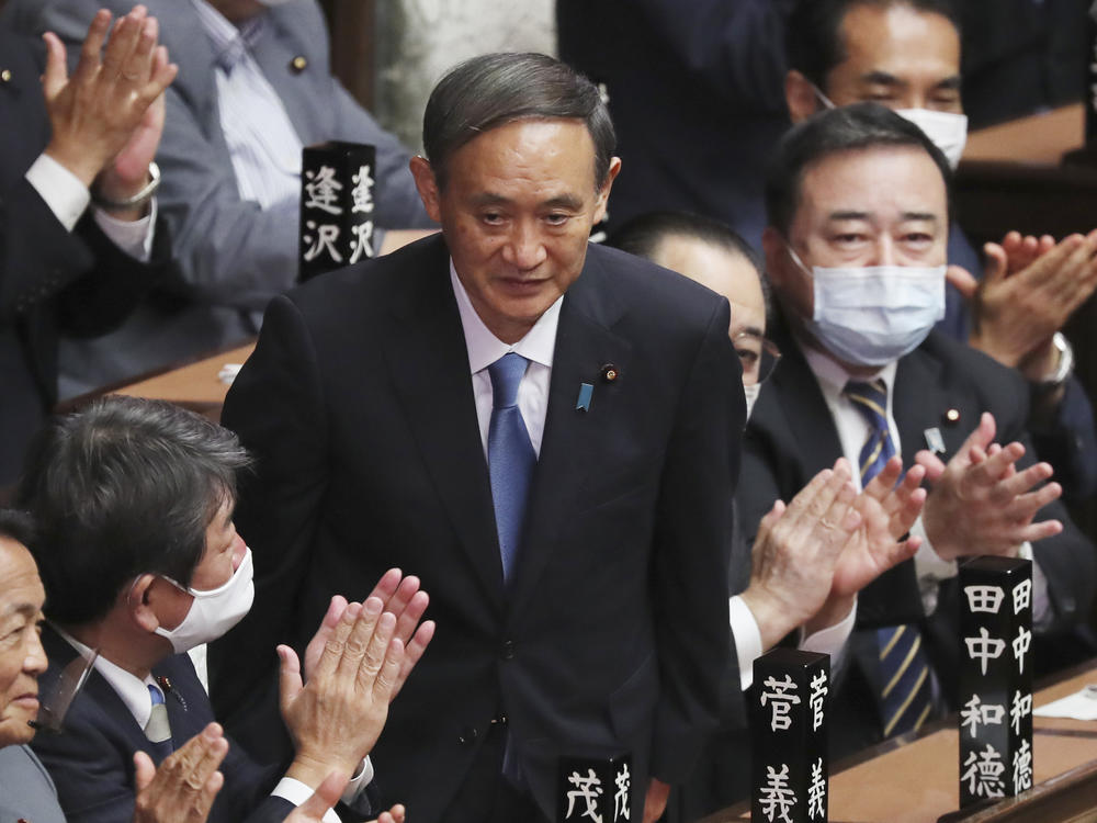 Yoshihide Suga receives applause Wednesday after being elected as Japan's new prime minister at Parliament's lower house in Tokyo.