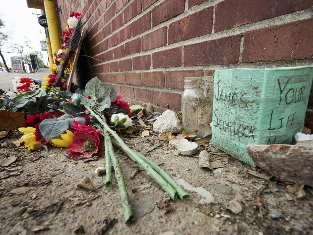 The site of James Scurlock's shooting death in Omaha, Neb., is still being preserved as a memorial in mid-September. On Tuesday, a grand jury indicted Jake Gardner in the killing, handing down four charges including manslaughter.