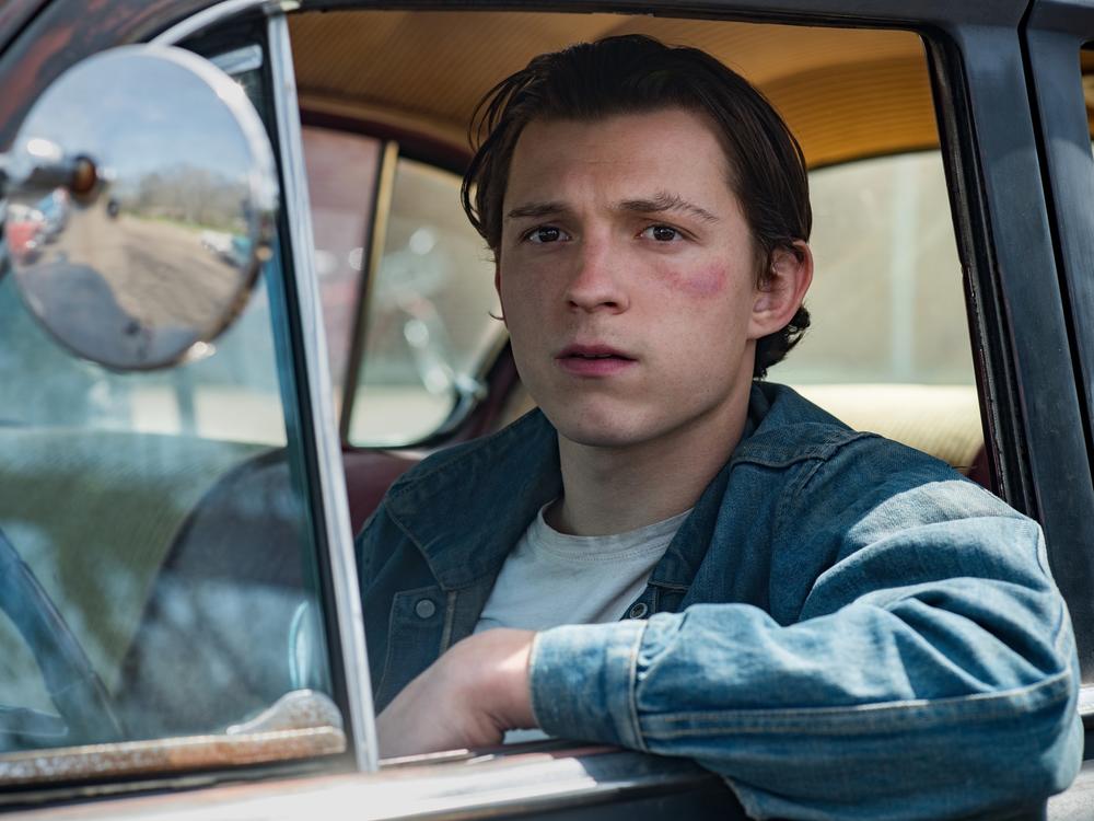 Tom Holland plays Arvin, a young man who refuses to let evil go unpunished in <em>The Devil All the Time. </em>
