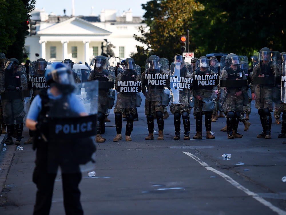 Military police hold a line near the White House on June 1 as demonstrators gather to protest police brutality in Washington, D.C.
