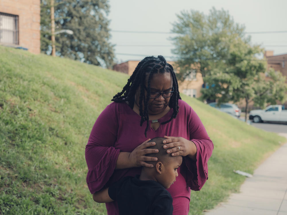 Patricia Stamper, with her 5-year-old son, works with children who have cognitive and physical disabilities at an elementary school in Washington, D.C.