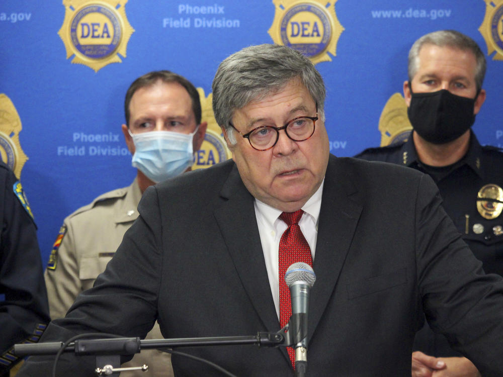 U.S. Attorney General William Barr, seen here in Phoenix on Sept. 10, called his colleagues at the Justice Department a 