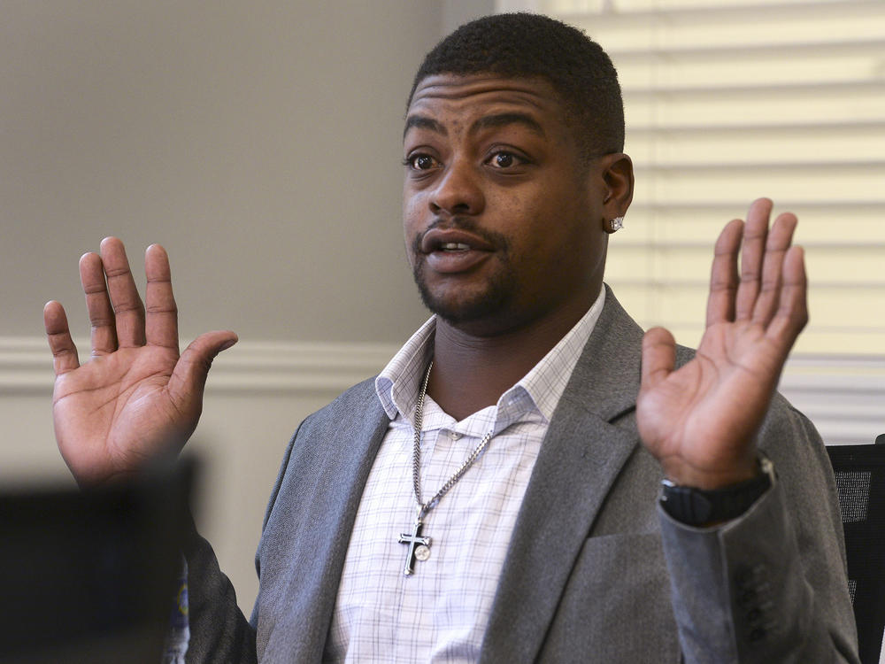 Jeffery Ryans, who sustained multiple dog bites, is shown here discussing his encounter with Salt Lake City police at his attorney's office in Salt Lake City.