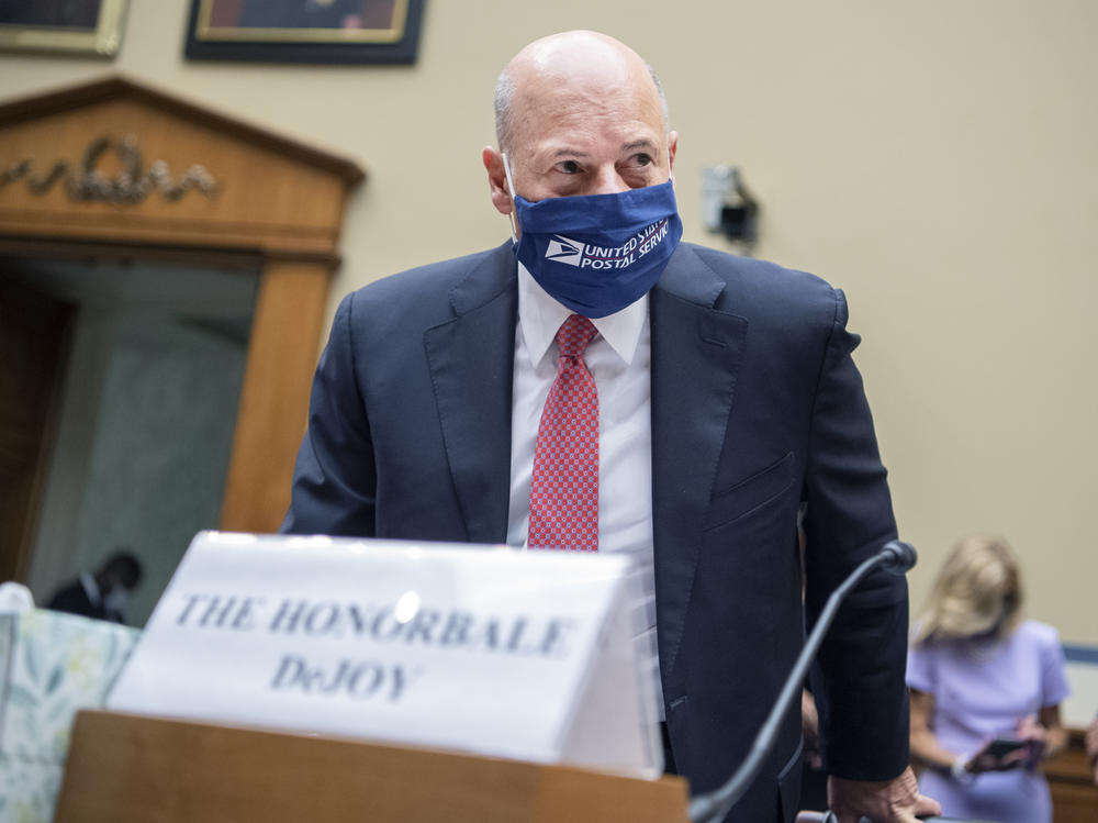 Postmaster General Louis DeJoy arrives to testify during a House Oversight and Reform Committee hearing in August.