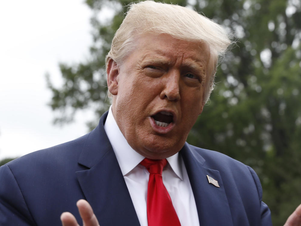 President Trump speaks to members of the media before boarding Marine One on the South Lawn of the White House in July.