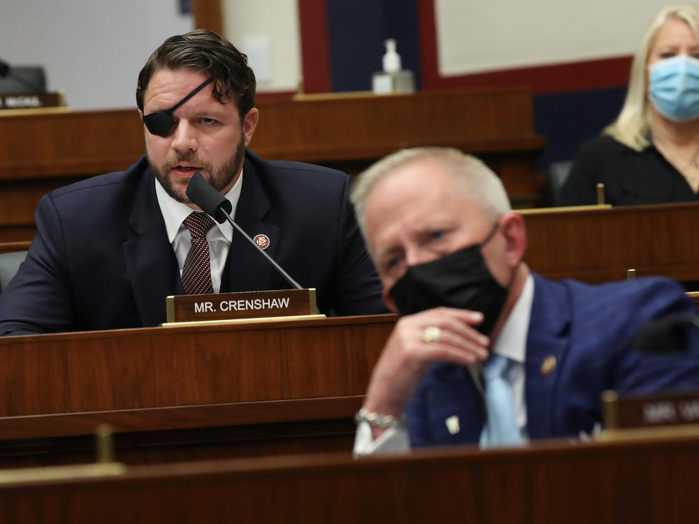 House Homeland Security Committee member Rep. Dan Crenshaw, R-Texas, questions witnesses during a hearing Thursday on threats to the United States.