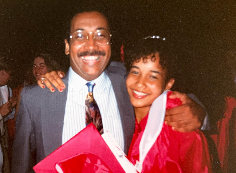 George Barlow embraces his teenage daughter Erin Haggerty at her 1991 high school graduation in Iowa City, Iowa.