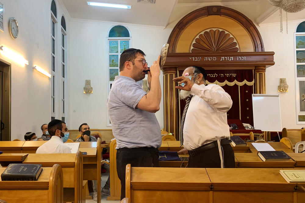 Rabbi Yehonatan Adouar (right) teaches a student during a shofar-blowing course in Rambam Synagogue in Ramat Gan, Israel.
