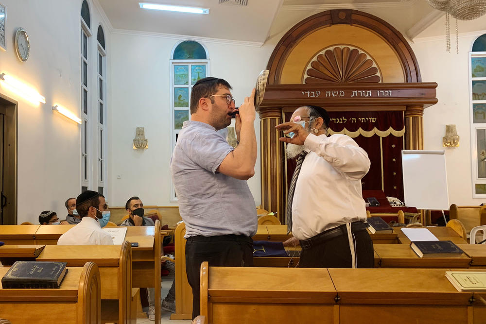 Rabbi Yehonatan Adouar (right) teaches a student during a shofar-blowing course in Rambam Synagogue in Ramat Gan, Israel.