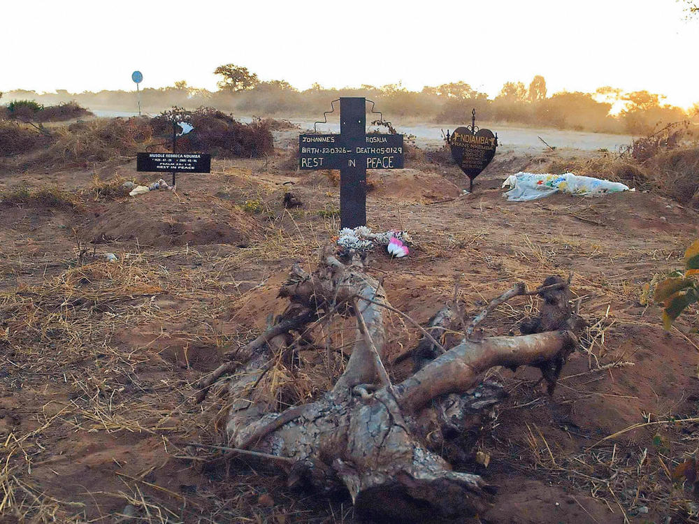 An illegal roadside graveyard in northeastern Namibia. People in the townships surrounding Rundu, a town on the border to Angola, are too poor to afford a funeral plot at the municipal graveyard — and resorted to burying their dead next to a dusty gravel road just outside of the town.