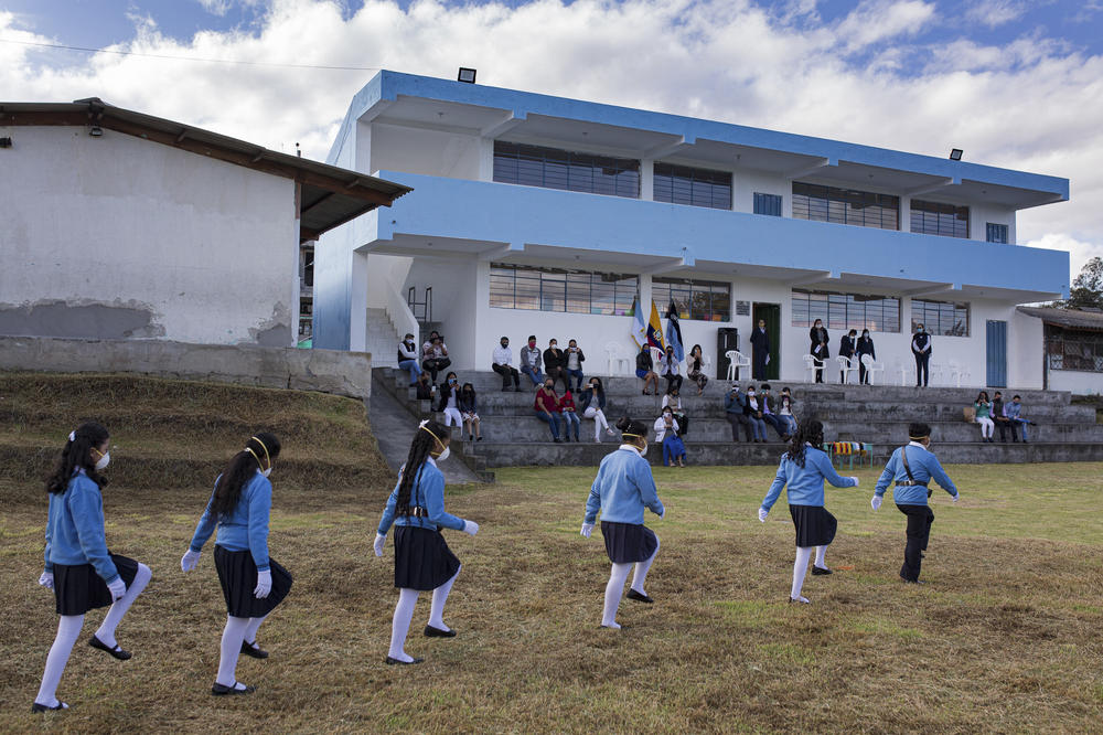 When the school year ended in Cotogchoa, only honor-roll students and their families were allowed to take part in the closing ceremonies — a measure devised for pandemic safety. <em>June 29. Cotogchoa, Ecuador.</em>