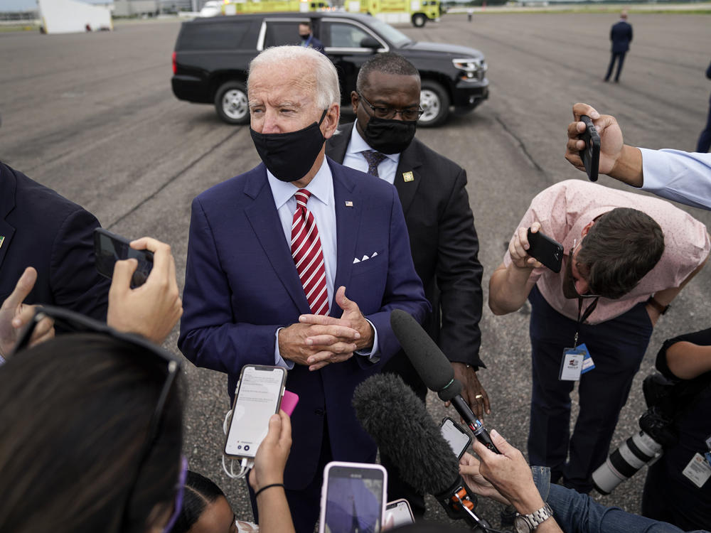 Democratic presidential nominee Joe Biden speaks to reporters before boarding his plane in Florida on Tuesday. Biden leads by 9 points against President Trump, who continues to face an uphill reelection battle.