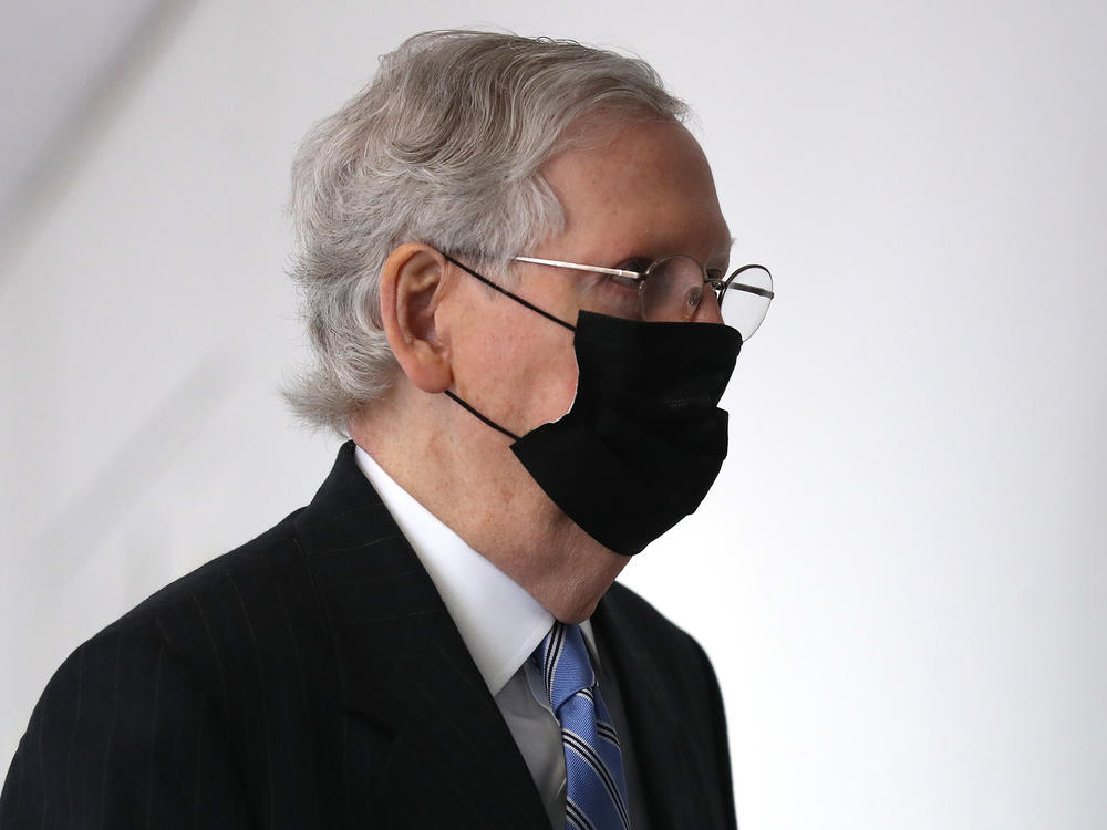 Senate Majority Leader Mitch McConnell arrives for a Republican Senate luncheon Wednesday on Capitol Hill.