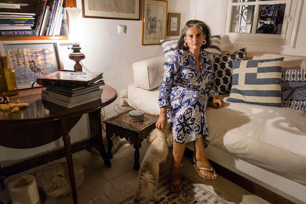 Constantina Agapitou Crowley, a former marketing executive and sixth-generation Kastellorizian, serves as the island's ambassador-at-large. She is pictured at home with her dog, Zoe.
