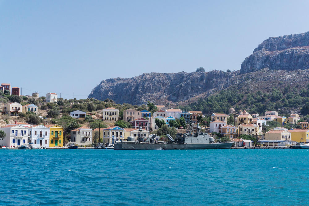 A Greek military ship is moored at the port of Kastellorizo.