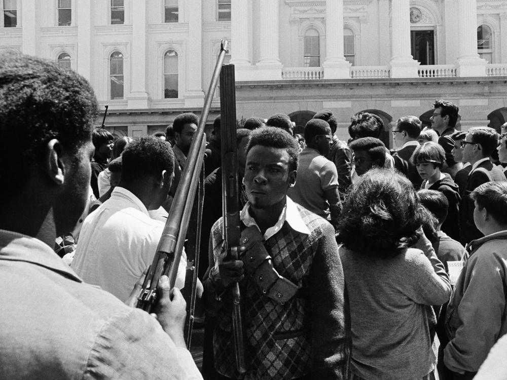 Armed members of the Black Panther Party leave the Capitol in Sacramento May 2, 1967. The Panthers entered the Capitol fully armed and said they were protesting a bill before the Legislature restricting the carrying of arms in public.