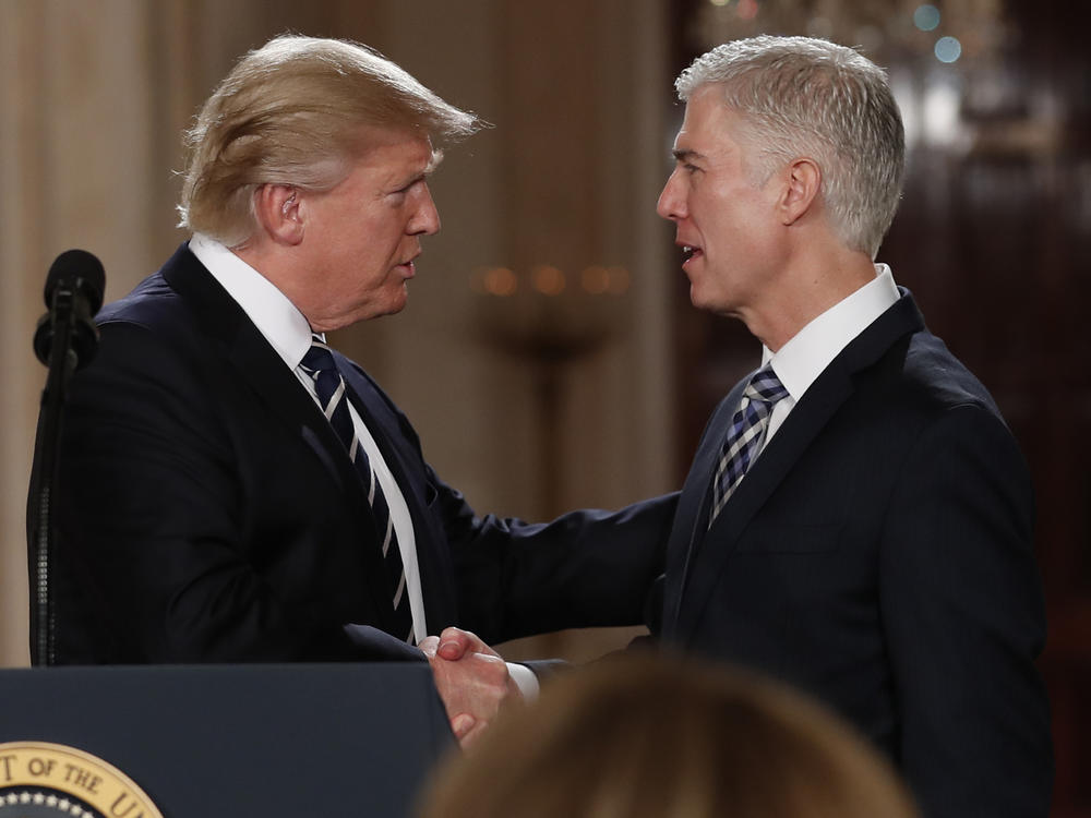 President Trump shakes hands with Neil Gorsuch, his first pick for a spot on the U.S. Supreme Court, on Jan. 31, 2017. The president will likely have the opportunity to name a replacement for Justice Ruth Bader Ginsburg, who died Friday.