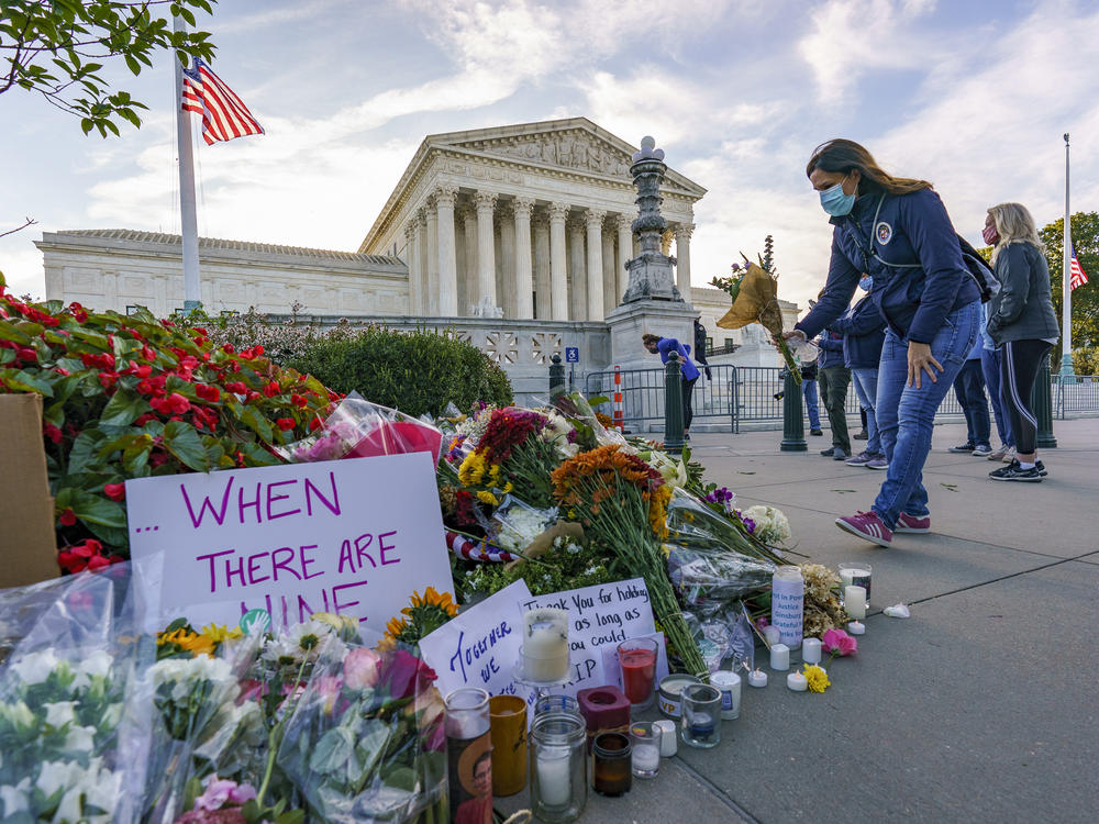 People gather at the Supreme Court on the morning after the death of Justice Ruth Bader Ginsburg.