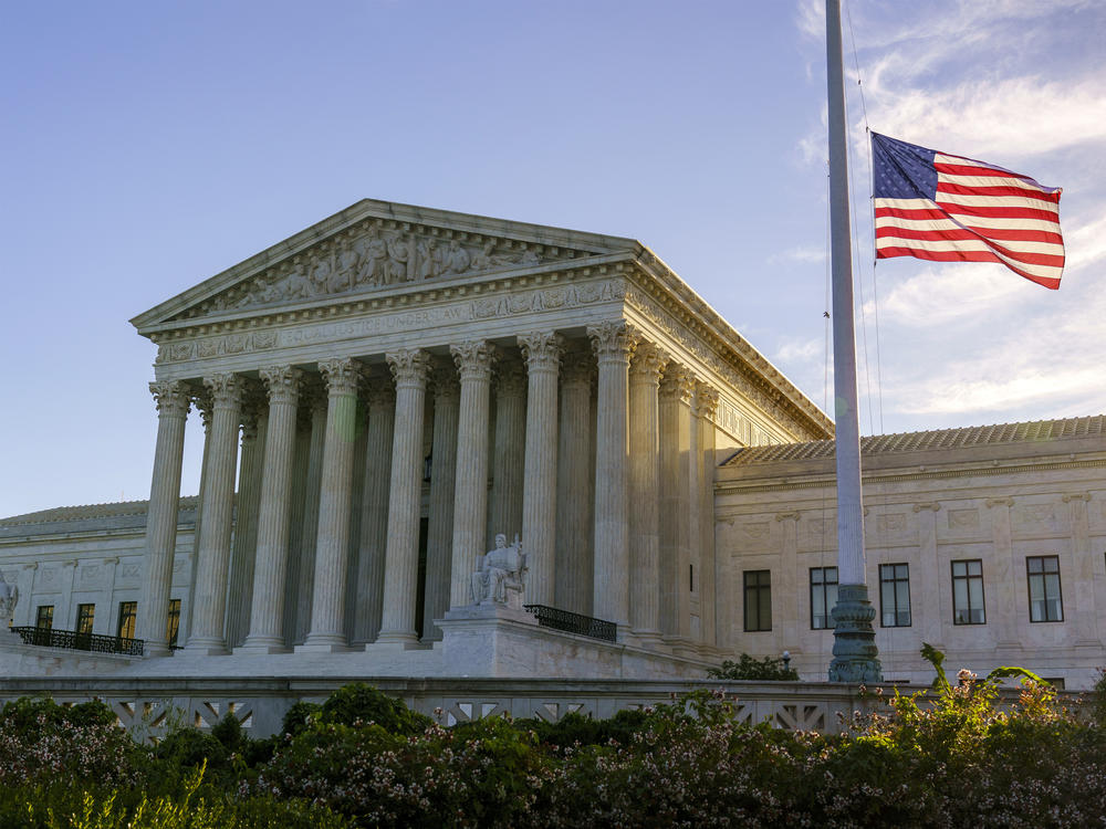 The flag flies at half-staff Saturday at the Supreme Court on the morning after the death of Justice Ruth Bader Ginsburg.