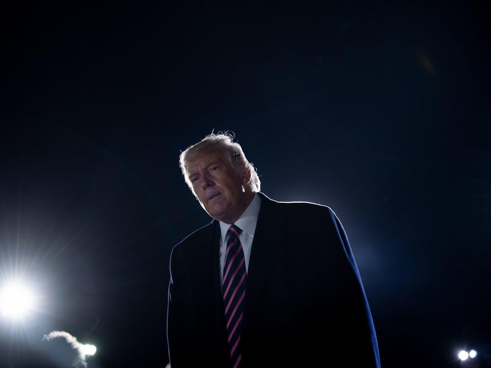 President Trump reacts to the news of the death of Supreme Court Justice Ruth Bader Ginsburg on Friday on the tarmac of Bemidji Regional Airport in Minnesota.