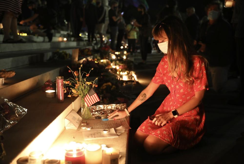 People lit candles and left flowers and notes on the steps of the court.