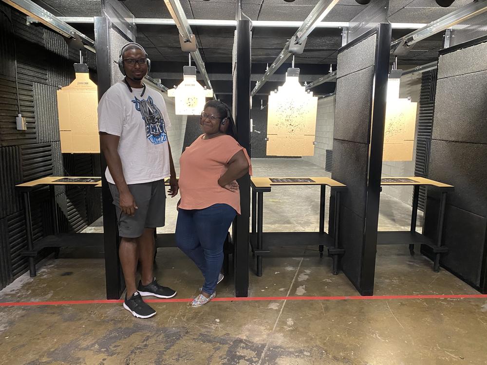 Kat Traylor and her husband Kevin Cox at a gun range.