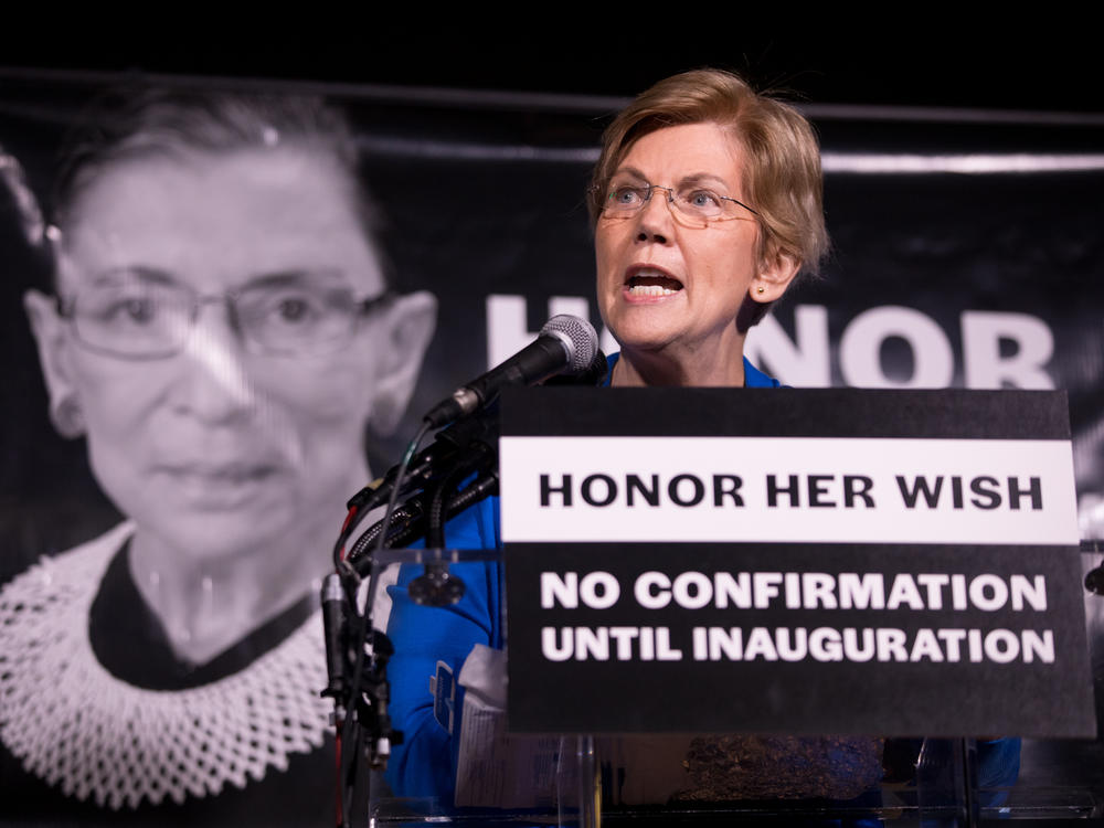 Sen. Elizabeth Warren, D-Mass., rallies the crowd of 2,500 people during a vigil Saturday night for Justice Ruth Bader Ginsburg in Washington, D.C.