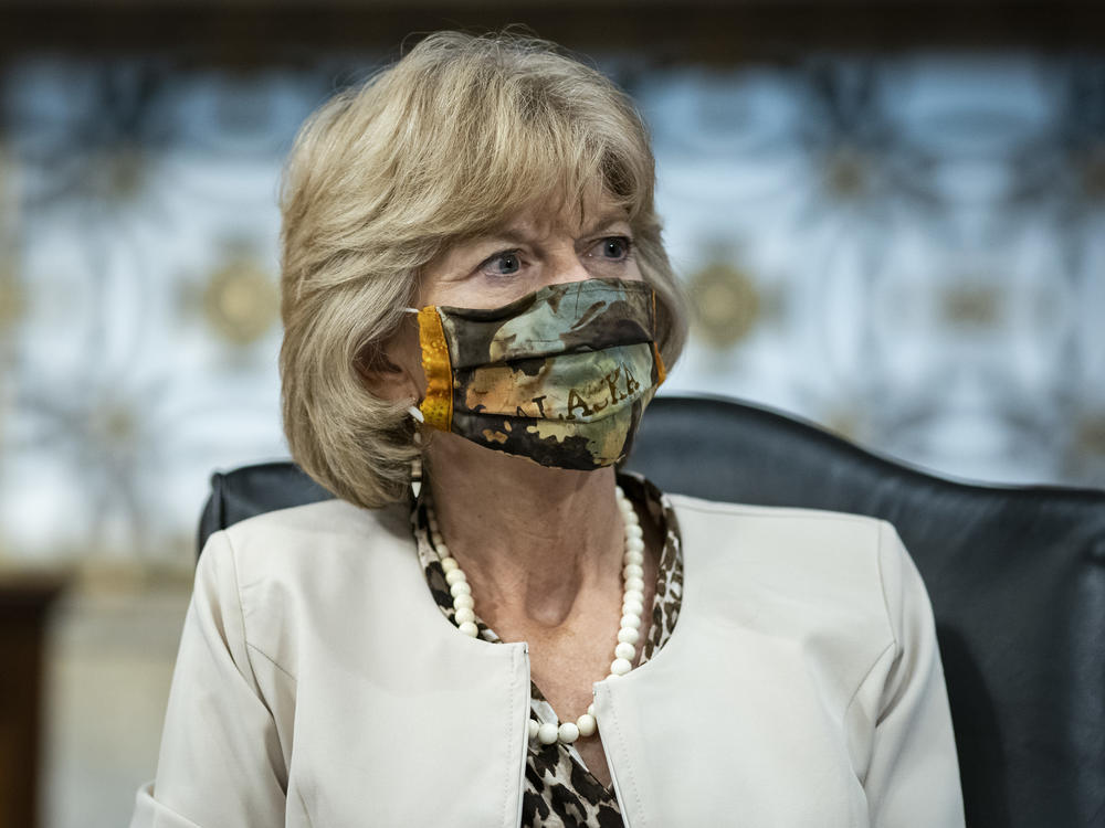 Sen. Lisa Murkowski, R-Alaska, wears a face covering during a committee hearing on June 30.