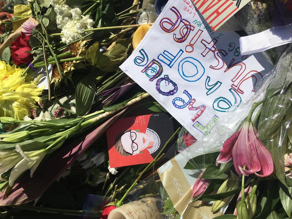Mourners have been leaving flowers and other mementos outside the U.S. Supreme Court in honor of the late Justice Ruth Bader Ginsburg.