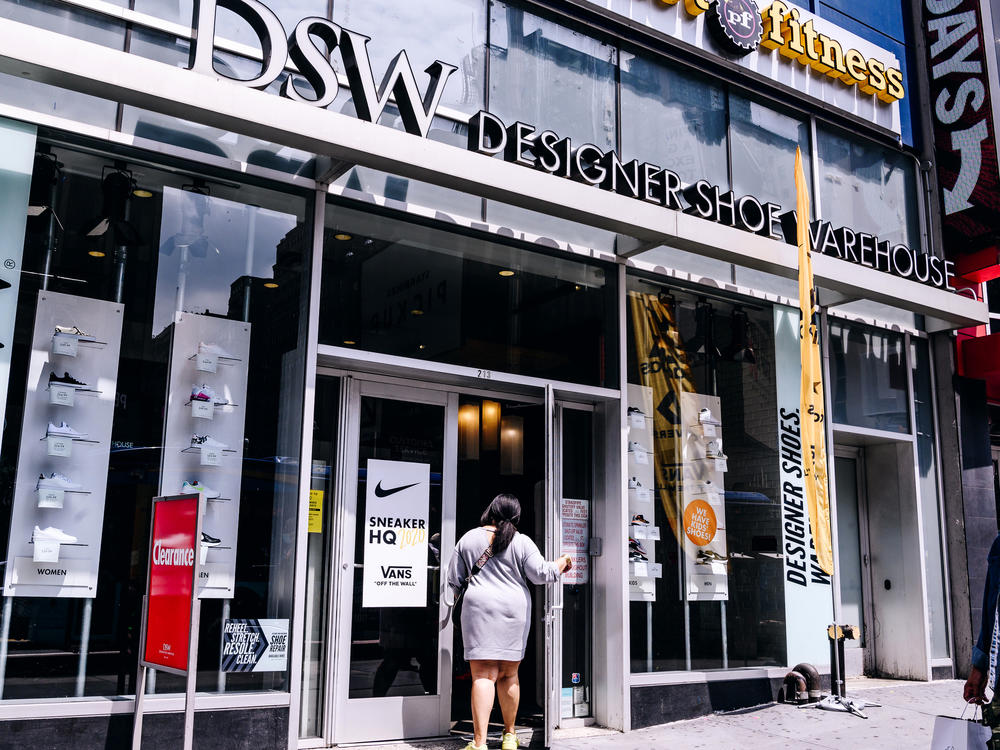 A shopper enters a DSW store in New York City. DSW is partnering with Hy-Vee, a Midwest supermarket chain, to offer shoes in grocery stores.