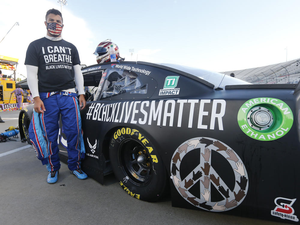 Driver Bubba Wallace waits for the start of a NASCAR Cup Series auto race in June in Martinsville, Va.