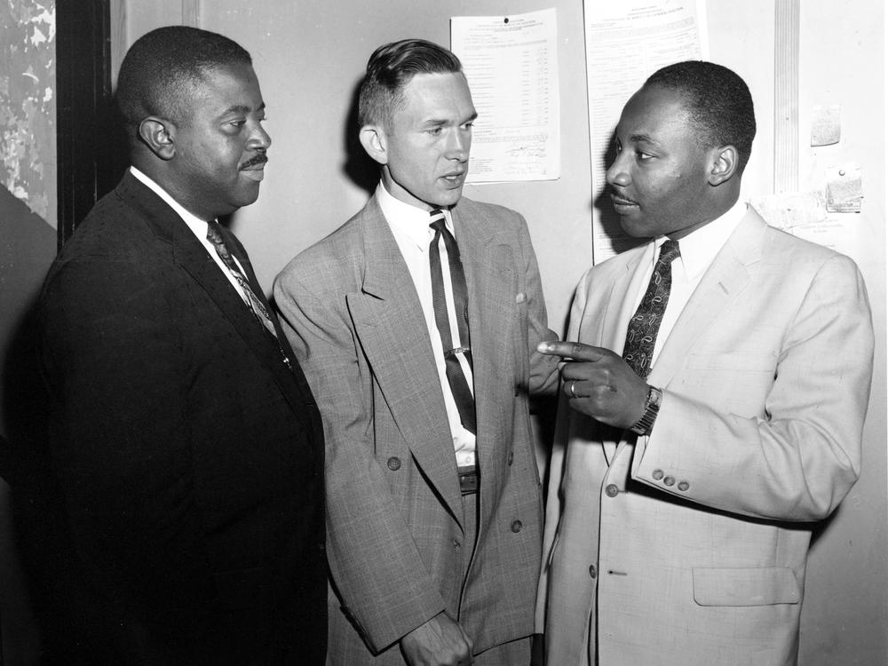 In this May 28, 1957, photo, Rev. Robert S. Graetz, center, Rev. Dr. Martin Luther King Jr. and Rev. Ralph D. Abernathy, left, talk outside the witness room during a bombing trial in Montgomery, Ala. Graetz, the only white minister to support the Montgomery Bus Boycott, died Sunday, Sept. 20, 2020. He was 92.