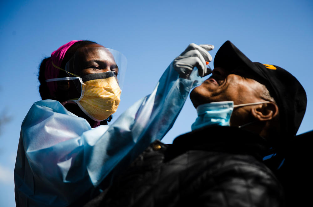 Dr. Ala Stanford administers a COVID-19 test in Philadelphia. Stanford and other doctors formed the Black Doctors COVID-19 Consortium to help address the pandemic's heath disparities.