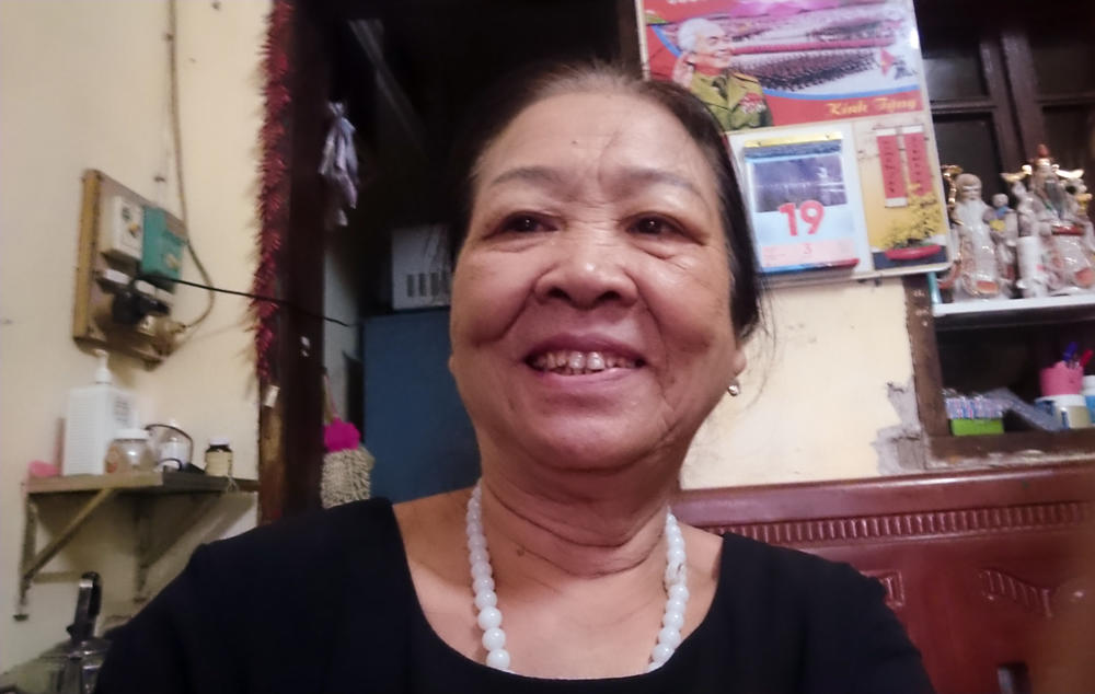 Dao Thi Hoa, 69, takes a selfie. Since she retired, she's been volunteering as the head of the Intergenerational Self Help Club in the Khuong Din ward of Hanoi.