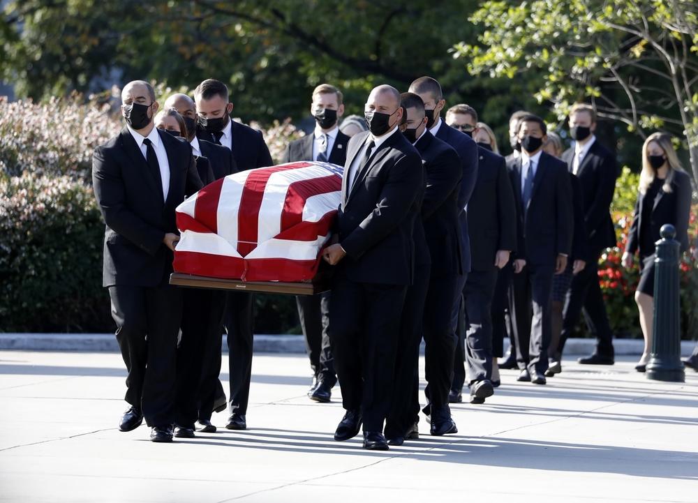 Pallbearers carry the casket of Associate Justice Ruth Bader Ginsburg.
