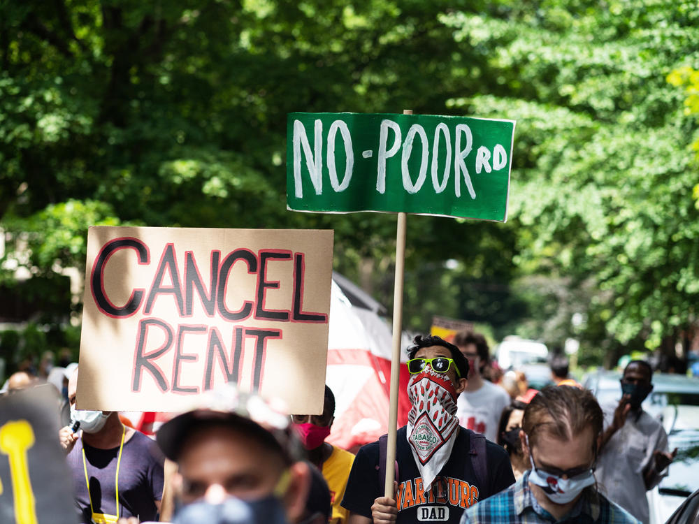Demonstrators march in Chicago's Old Town neighborhood in June to demand a lifting of the Illinois rent control ban and a cancellation of rent and mortgage payments. The pandemic's financial pressures are causing many Americans to struggle with rent payments.