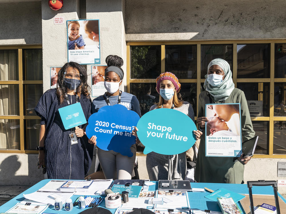 U.S. Census Bureau workers promote the national head count outside of Sylvia's Restaurant in New York City's Harlem neighborhood.