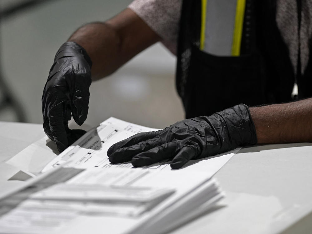 A worker prepares absentee ballots for mailing at the Wake County Board of Elections in Raleigh, N.C., earlier this month.