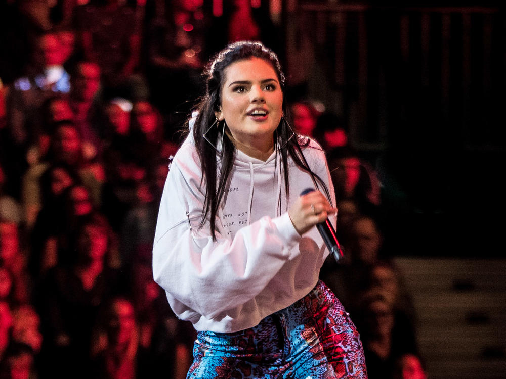 Dutch YouTube star turned model and singer Famke Louise performs on stage during a live show on television in the Netherlands. Famke Louise has come under fire recently for saying she would no longer participate in public campaigns to combat COVID-19.