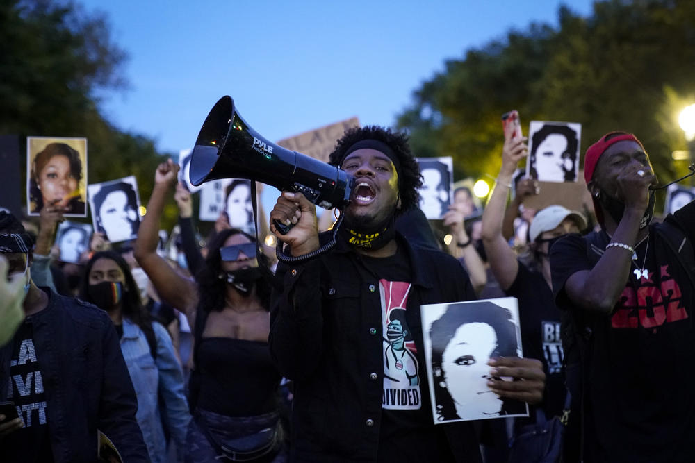 Demonstrators march along Constitution Avenue in Washington, D.C., following the Kentucky grand jury decision.