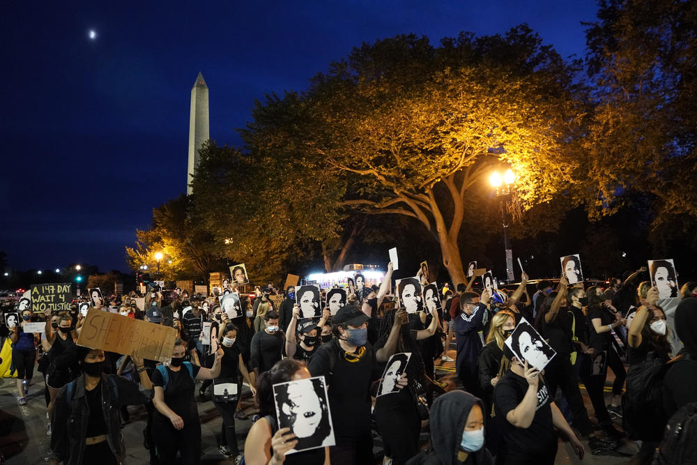 Demonstrators march near the White House in Washington, D.C.