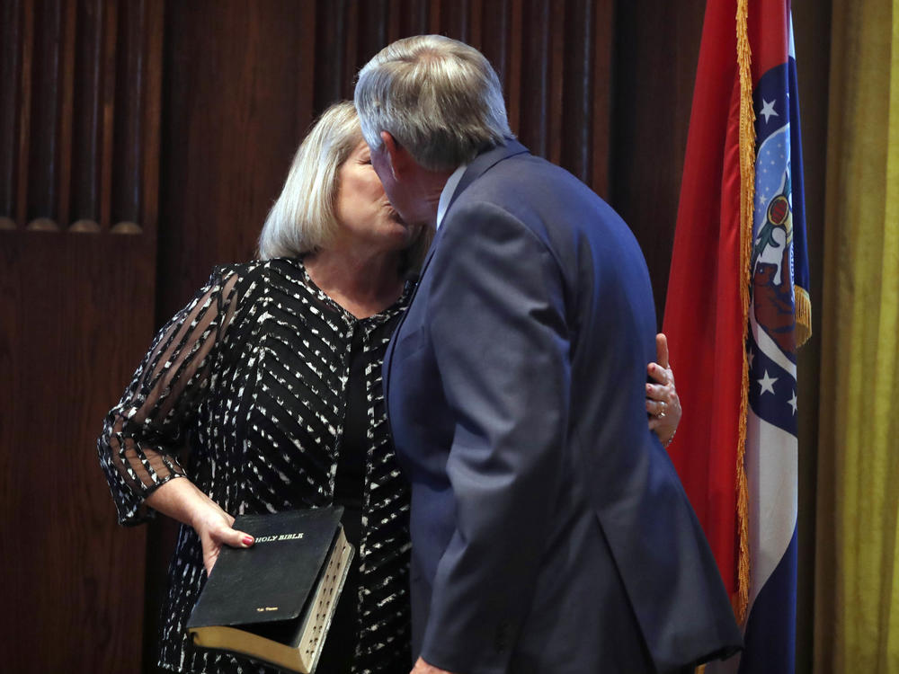 Gov. Mike Parson and his wife, Teresa, share a kiss after he was sworn in as Missouri's 57th governor in 2018.