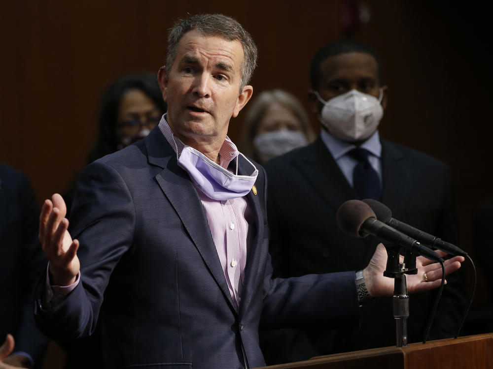 Virginia Gov. Ralph Northam, shown here at a news conference in June, has tested positive for the coronavirus.