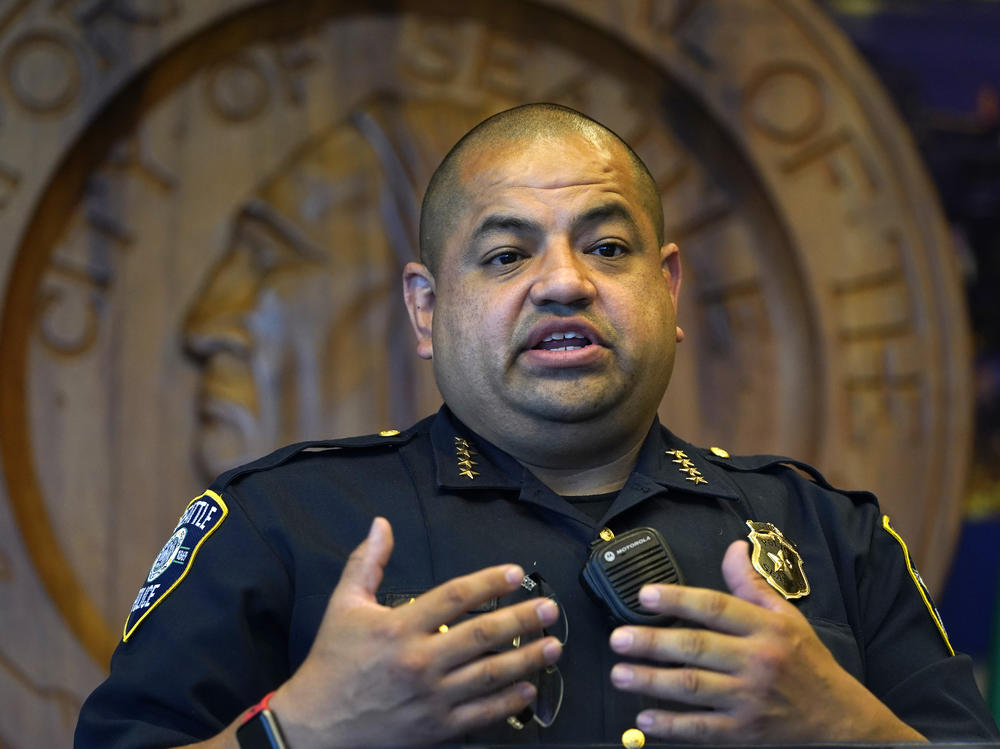 Interim Seattle Police Chief Adrian Diaz addresses a news conference about changes being made at the department, earlier this month. The SPD announced Thursday that an officer seen on video rolling his bicycle over a downed protester was suspended pending an investigation.