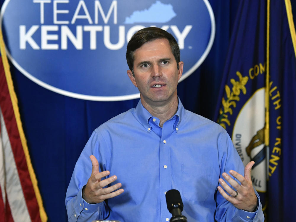 Kentucky Gov. Andy Beshear addresses the media following the return of a grand jury investigation into the death of Breonna Taylor in Frankfort, Ky., on Wednesday. Beshear has made a request to Kentucky Attorney General Daniel Cameron to release the grand jury transcripts to the public.