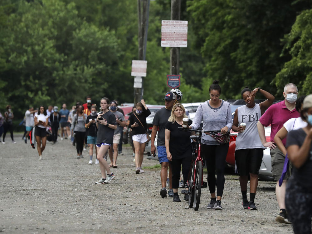 People wait in line to vote in Georgia's June 9 primary election at Park Tavern in Atlanta.