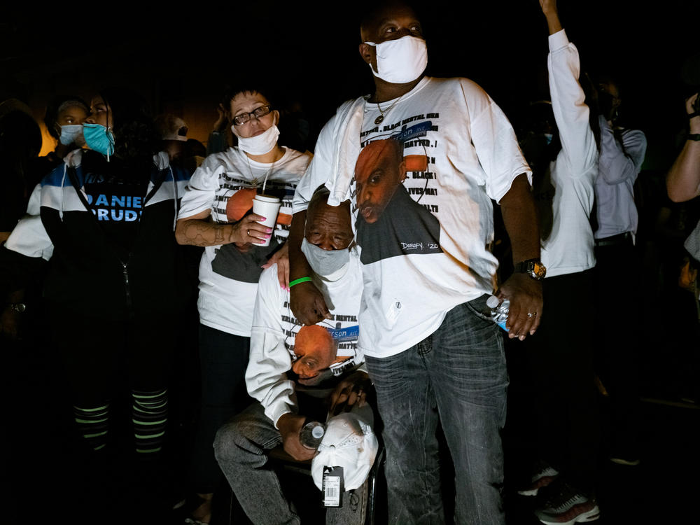 Relatives of Daniel Prude, visiting from Chicago and Florida, take part in a community celebration of life in Prude's memory on Sept. 10 in Rochester, New York. The event took place on Jefferson Avenue, the street where police arrested Prude March 23, an encounter which led to his death.